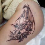 flower dragon fine line tattoo