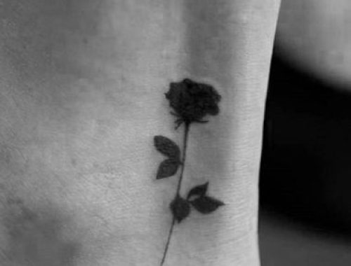 Small flower rose blackwork tattoo