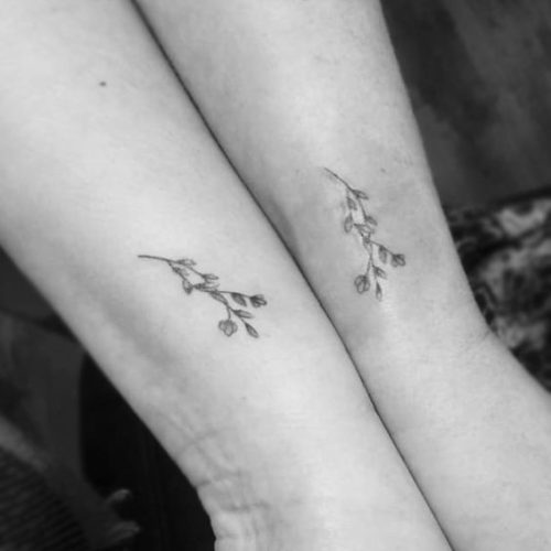 matching small flower tattoo