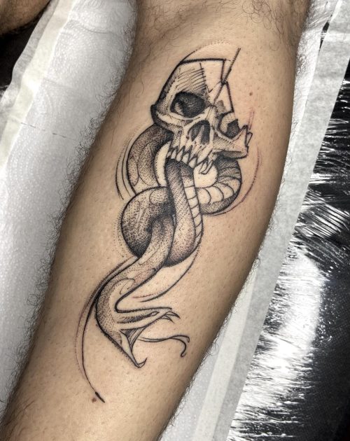 sketchy skull and snake tattoo